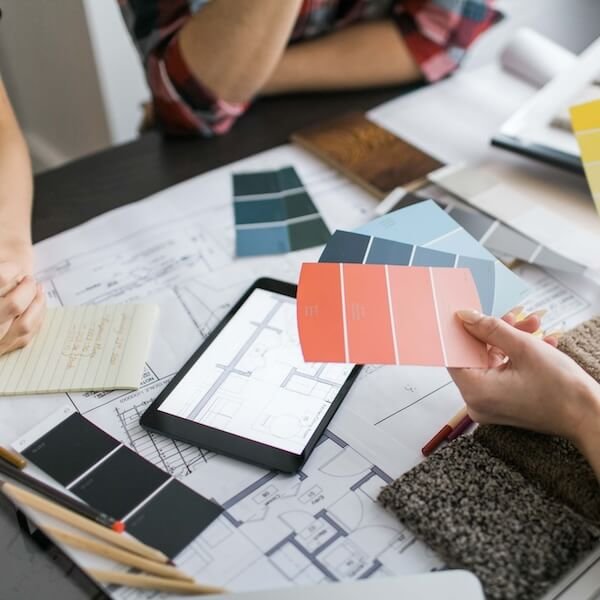 A client looking at a color swatch during a paint consultation.